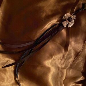 EAGLE PURSE CHARM WITH BLUE AND BROWN LEATHER LACE